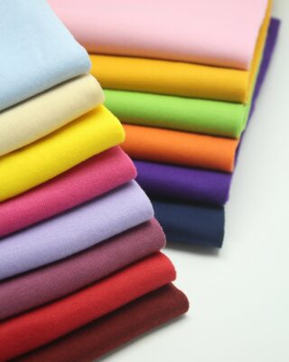 New Arrivals collection – folded fabric and clothing